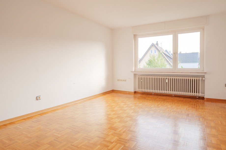 Wohnzimmer OG links Mehrfamilienhaus Bielefeld / Heepen